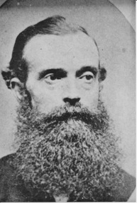 Black and white photograph of gentleman with full beard and moustache