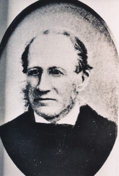 Black and white portrait of gentleman with a squared collar