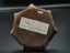 Base of ashtray with label with identifier at top and information below