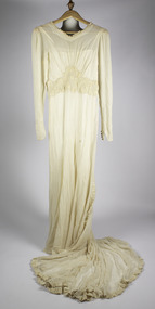 wedding dress with long sleeves and train in front