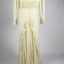 back of weeding dress with panels showcasing train with ruffles around edge