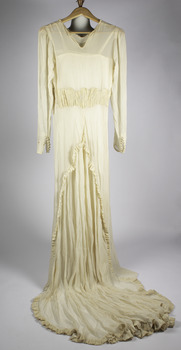 back of weeding dress with panels showcasing train with ruffles around edge