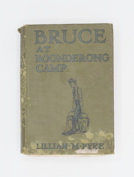 Book with green cover with an outline drawing of a boy carrying two buckets of water