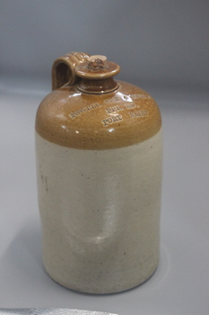 two coloured large pottery bottle with handle and Powell, Orr & Goldie PPY ED. Port Fairy inscribed on shoulder