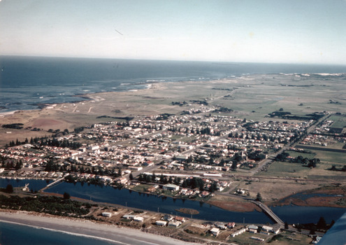Coloured aerial photograph taken from the sea looking over the Moyne river with the two bridges in the foreground