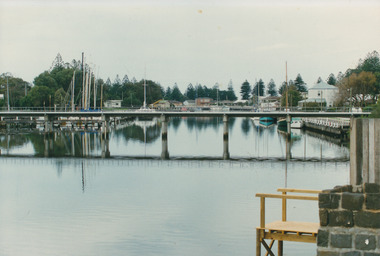 Coloured photograph of the Moyne river taken from the West side of the footbridge looking to the wharf