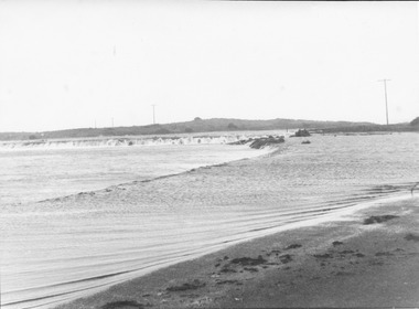 High tide and storm flooding the causeway near the south west passage