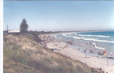 East Beach with summer crowd and life savers flags