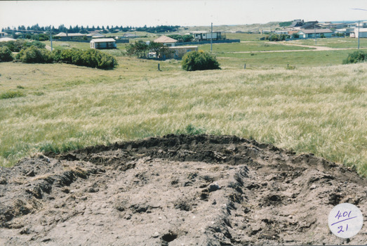 Earthworks in foreground with some housing on the South beach estate in background