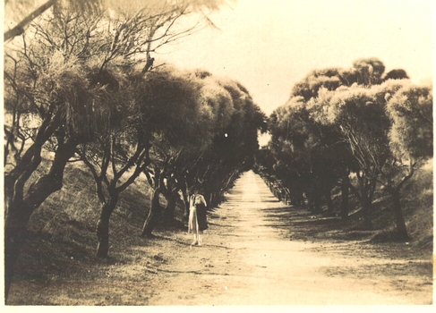 Woman standing on track which leads to South Beach