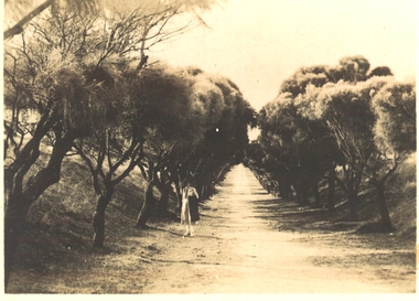 Woman standing on track which leads to South Beach
