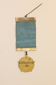 the reverse side of medal with inscriptions on medal 