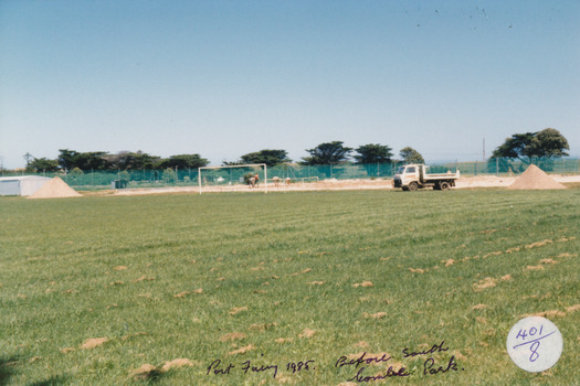 Grassed area with improvement works in background