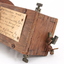 Wooden rectangular device with cone shaped speaker/microphone at one end.