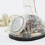 Clear plastic telephone with dial underneath long stemmed handle; colourful electrical wires visible within.