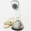 Clear plastic telephone with dial underneath long stemmed handle; colourful electrical wires visible within.