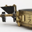 Gold coloured metal compass case with engraved lid; compass face is green printed paper with glass top.