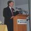 Robin Pleydell addresses the crowd from a podium on stage