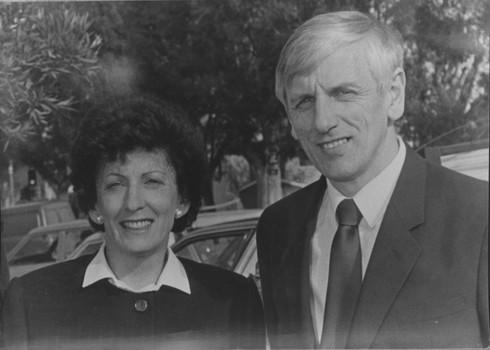 John Cook and unidentified woman stand in car park