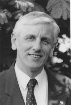 Portrait photo of John Cook in black and white