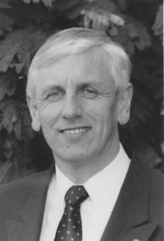 Portrait photo of John Cook in black and white