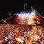 Melbourne city skyline at night with Myer Music Bowl and crowds