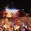 Melbourne city skyline at night with Myer Music Bowl and crowds