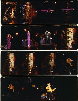 Various performers singing on stage at Carols