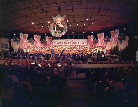 1977 stage setting with colourful giant cherubs with horns flying along the back and middle top