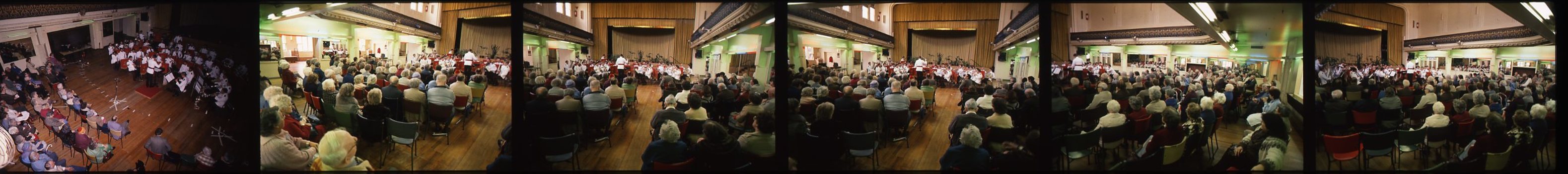 Choir and band members crowd in Ormond Hall for rehearsals