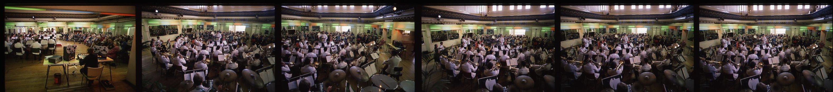 Choir and band members crowd in Ormond Hall for rehearsals