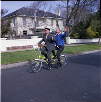 Hubert Opperman and Arthur Wilkins riding a tandem bicycle