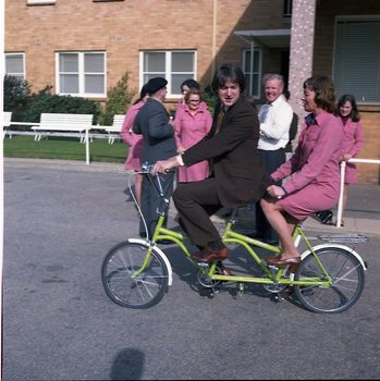Murray Mountain and female dressed in pink riding a tandem bike