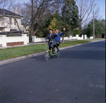 Hubert Opperman and Arthur Wilkins riding a tandem bicycle