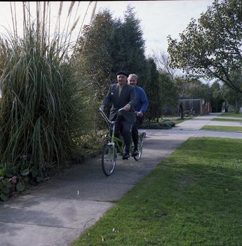 Hubert Opperman and Arthur Wilkins riding a tandem bicycle