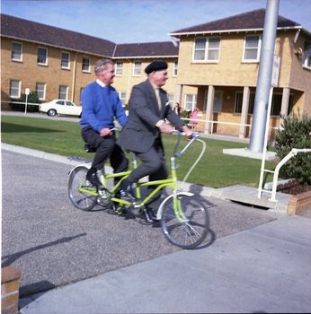 Hubert Opperman and Arthur Wilkins riding a tandem bicycle