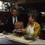 Robin Pleydell stands next to female client holding a clay bowl