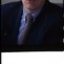 Portrait images of John Cook in his office