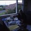 Side view of John Cook in his office and what he can see out the window