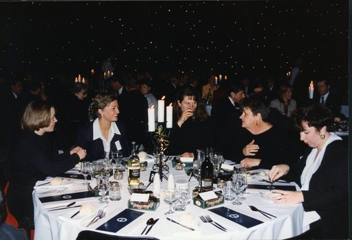 Five women around a table at the luncheon, with Janet Cronin second from the right