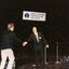 Pete Smith puts out his hand to shake that of Peter Cupples as he comes on stage