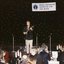 Peter Cupples singing to the audience and playing guitar