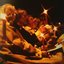 A group of seated adults holding candles