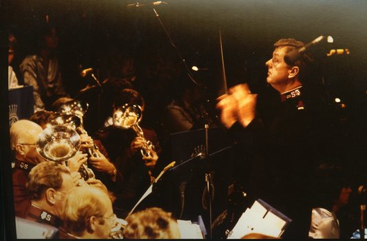 Salvation Army bandmaster Colin Woods conducting the orchestra