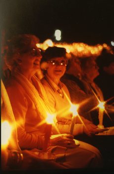 Ladies in the audience holding candles
