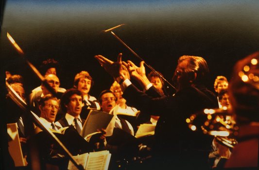 Choirmaster Jim Watsford conducting the choir