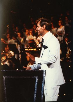 Brian Naylor on stage at Carols