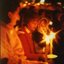 Family holding candles in the audience