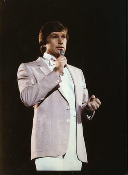 Denis Walter on stage at Carols