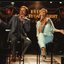 Paul Meenie and Linda George singing on stage